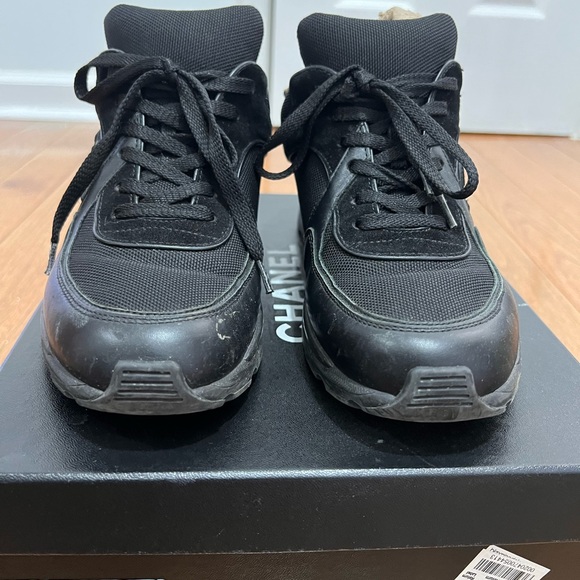 Chanel all-black sneakers are classic, chic, and never out of style. - Picture 1 of 4